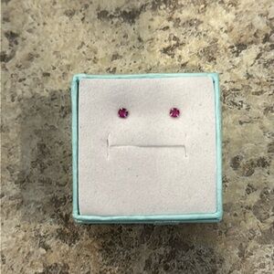 Tiny red earrings. Perfect for little ears and babies